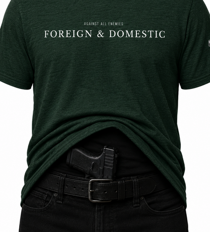 Dark green t-shirt with 'FOREIGN & DOMESTIC' text on a white background