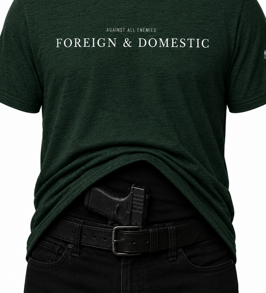 Dark green t-shirt with 'FOREIGN & DOMESTIC' text on a white background